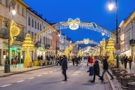 Warsaw, Poland - January 8, 2022: People on New World Street (Nowy Swiat), closed to traffic during holiday season, part of the Royal Route in the capital city centre.のeditorial素材