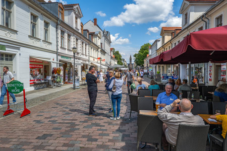 Potsdam, Germany - August 6, 2021: People on popular Brandenburger main shopping street lined with stores and cafes in the city center.のeditorial素材