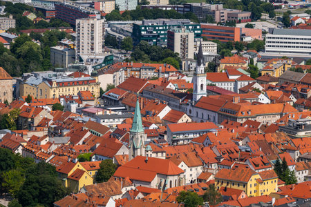 City of Celje cityscape in Slovenia, view above red tiled roofs of the Old Town.の写真素材