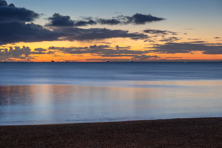 The Baltic Sea on tranquil dawn from a beach in Gdynia Orlowo, Poland.の写真素材