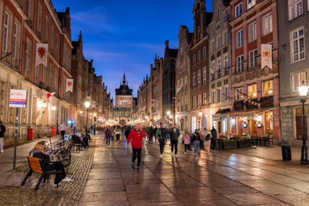 Gdansk, Poland - October 5, 2022 - People at Long Lane main pedestrian street in the Old Town of Gdansk city at night, part of the Royal Route.のeditorial素材