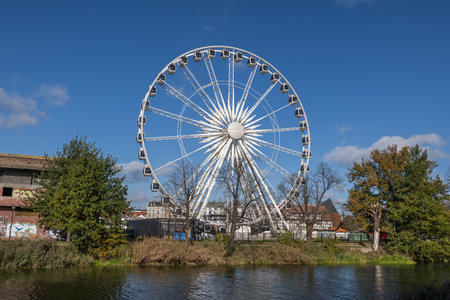 Gdansk, Poland - October 11, 2022 - AmberSky ferris wheel, 50-meter tall construction with 36 gondolas, major tourist attraction and city landmark.のeditorial素材