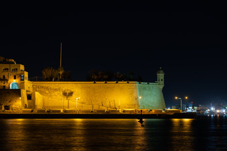 Wall of Senglea town at night in Malta. The Spur - seaward bastion fortification at the Grand Harbour.の写真素材