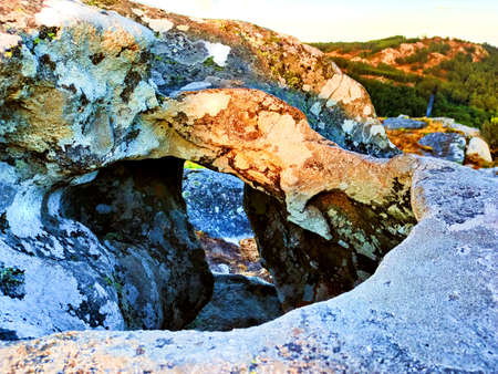 Natural stone hole in mountain, Galicia, Spain.