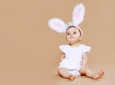 Sweet cute baby in costume easter bunnyの写真素材