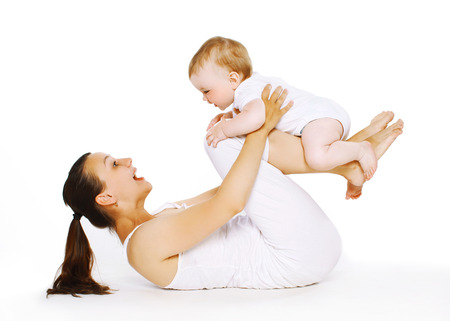 Mother and baby are doing exercise, gymnastics, fitness, play - conceptの写真素材