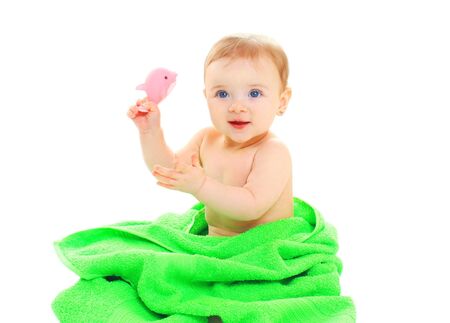 Portrait cute little baby under towel on white backgroundの写真素材