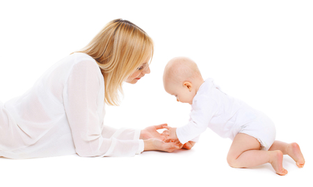 Mother playing with baby on a white backgroundの写真素材