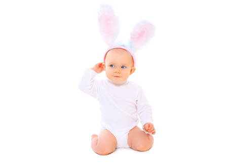 Sweet baby in easter bunny ears on a white background