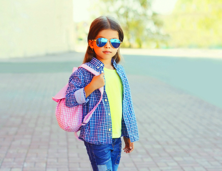 Fashion portrait little girl child on city street