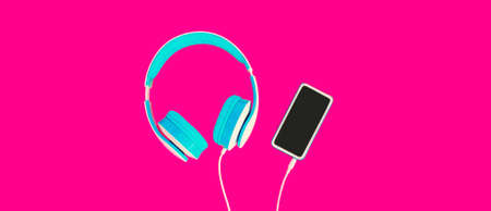 Music concept blue headphones and smartphone with blank black screen on colorful pink backgroundの写真素材