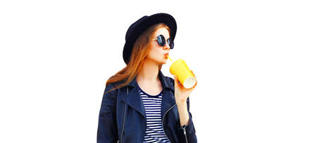 Portrait of stylish young woman enjoying drinking juice looking away wearing black rock style...