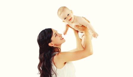 Portrait of happy smiling mother and baby playing together on white backgroundの写真素材