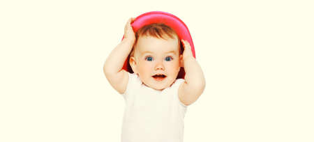 Portrait close up of happy cheerful smiling baby with hat on white backgroundの写真素材