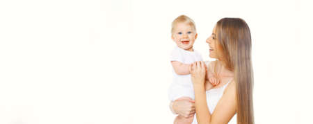 Portrait of happy smiling mother and baby playing together on white backgroundの写真素材