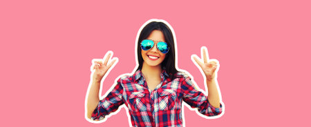 Portrait of cheerful happy smiling young brunette woman in sunglasses on pink background