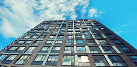 Architecture and real estate, residential apartment building with large panoramic windows, modern complex backgroundの写真素材
