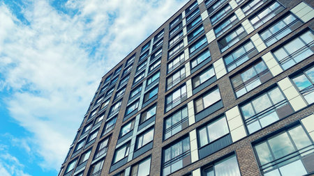 Architecture and real estate, residential apartment building with large panoramic windows, modern complex backgroundの写真素材