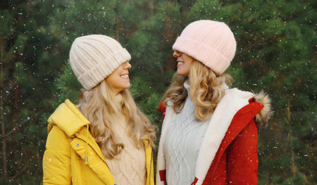 Happy laughing women friends having fun, celebration, joyful girlfriends together on Christmas tree...