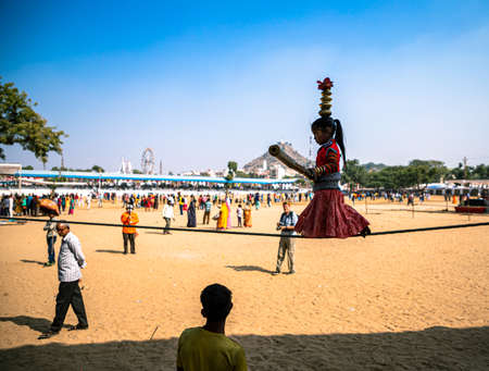 portrait of a man smoking bidi at pushkar festival,rajasthan.のeditorial素材
