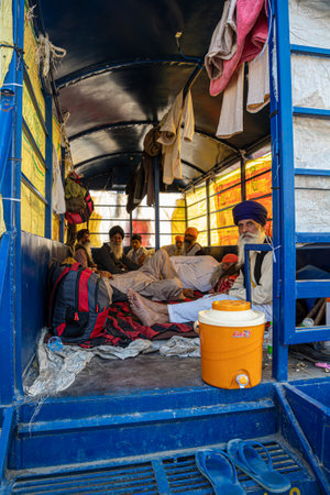 a group of farmers sitting in their trolley and protesting against new farm law passed by indian government at delhi haryana border.のeditorial素材