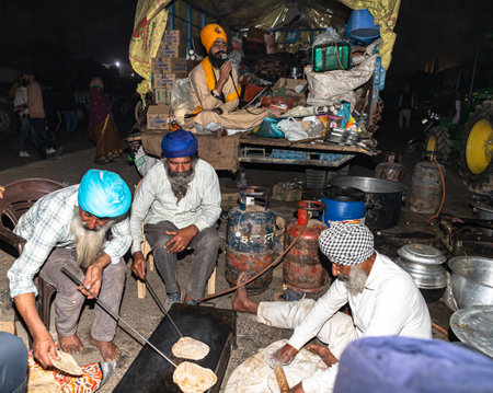 indian farmers making food at delhi border,they are protesting against new farm law passed by indian government.のeditorial素材