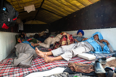 indian farmers sleeping in their trolley at delhi border,they are protesting against new farm law...