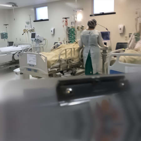 Doctors performing operation photo in covid hospital have shallow depth of field selective focus blur and wonderland background wearing PPE kit and surgical Mask as protective safety photo noise free in trend and demand , doing surgery, operation.のeditorial素材