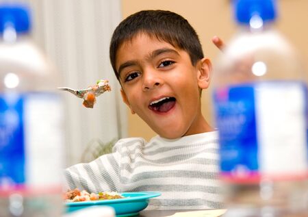 A child enjoying his meal at home