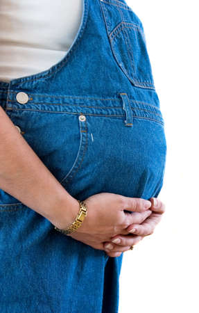 Profile of a pregnant woman holding her 