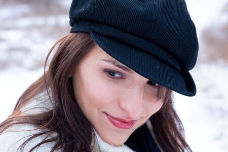 A beautiful young woman smiles to herselfの写真素材