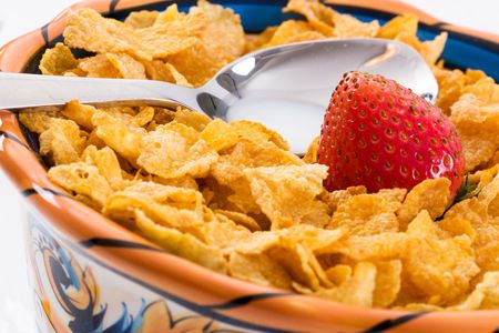 Macro shot of a strawberry with corn flakes. Focus on the strawberry. Part of the breakfast series...
