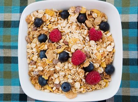 Breakfast Series - Close-up of a bowl of Muesli cereal with Raspberries and Blueberries