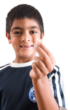 A six year old boy shows off his broken toothの写真素材