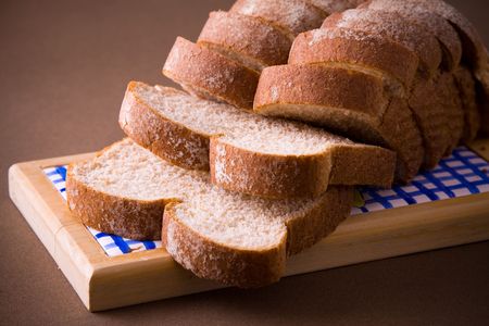 A loaf of sliced whole wheat bread