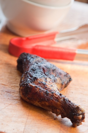 Barbecued chicken leg also known as Jerk Chicken - Caribbean style  Shallow DOF の写真素材