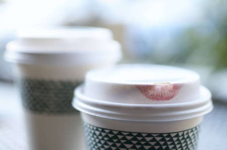 lipstick imprint on the lid of a disposable coffee cupの写真素材