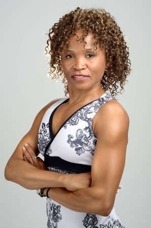 Upper body shot of a fit, toned woman wearing a halter neck sports topの写真素材