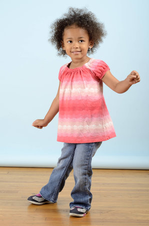 Little girl doing a danceの写真素材