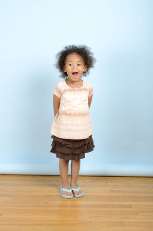 Mixed race girl with a surprised expressionの写真素材