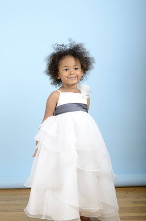 little girl wearing a white formal dressの写真素材