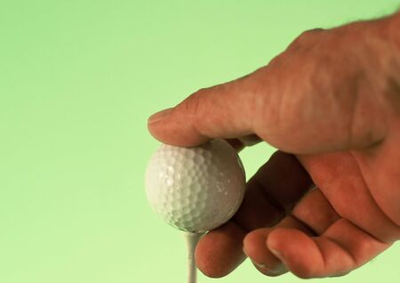 golf ball on a teeの写真素材