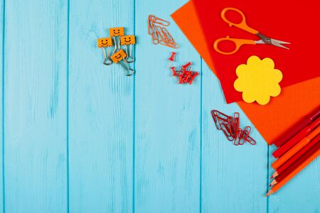 Red and orange pencils, felt-tip pens, notepaper, paper clips, stationery nails, felt and scissors...