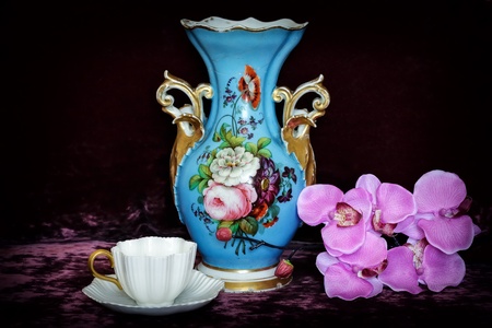 Still life with flowers and antique cup