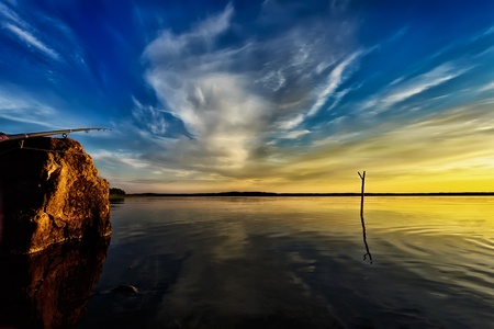 A dramatic sunset on a beautiful lakeの写真素材