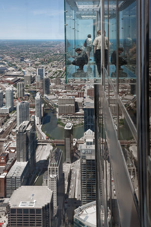 CHICAGO, USA - JUNE 3, 2010:  Tourist in The Ledge, glass balconies in 103th floor of the Sears Tower in Chicagoのeditorial素材