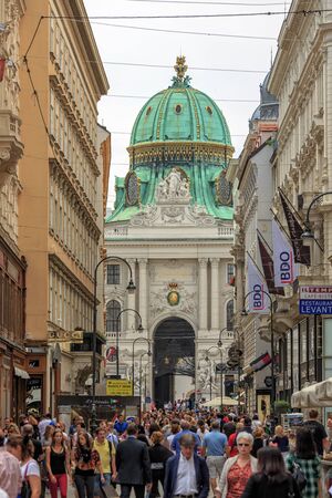 VIENNA, AUSTRIA - JUNE 27, 2015: Tourists on Kohlmarkt street with Hofburg Complex in downtown of Vienna in Austriaのeditorial素材