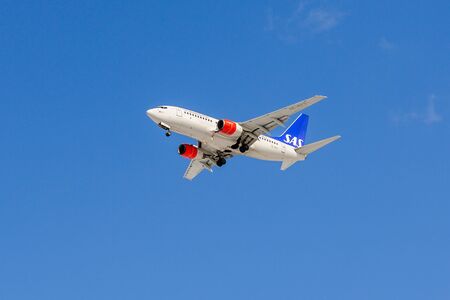 SAINT PETERSBURG, RUSSIA - APRIL 19, 2017: Flying the Boeing 737-7BX (SE-RES) airline Â«SAS Scandinavian AirlinesÂ». The plane goes on landing at Pulkovo airport.のeditorial素材