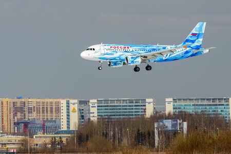 SAINT PETERSBURG, RUSSIA - APRIL 19, 2017: Flying the Airbus A319-111 (VQ-BAS) airline Â«Rossiya - Russian AirlinesÂ» in the color of the football club "Zenith". The plane goes on landing at Pulkovo airport.のeditorial素材