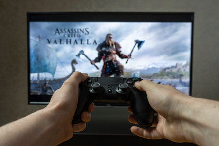 Point of view video gaming. Playing video game on Playstation.  Assasins Creed Valhalla
